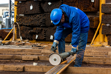 Construction worker handling building materials at a construction site in Nigeria
